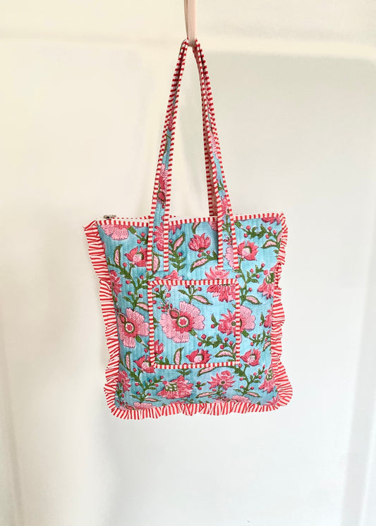 Gewatteerde laptoptas met volant blauw/roze