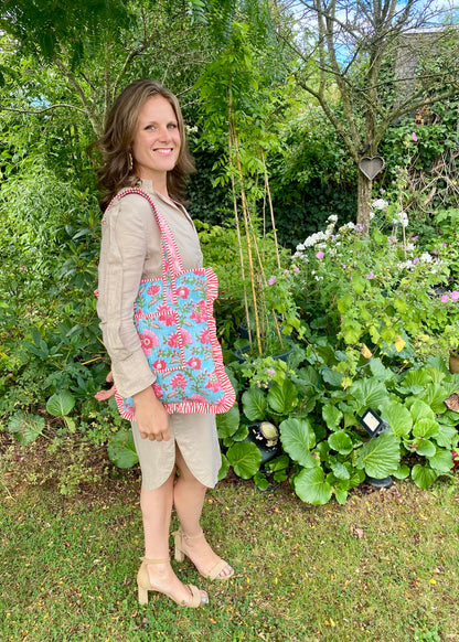 Gewatteerde laptoptas met volant blauw/roze