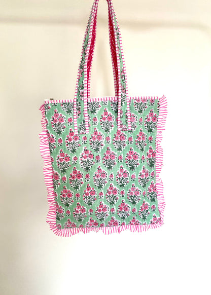 Gewatteerde laptoptas met volant groen/roze