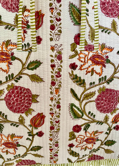 Gewatteerde laptoptas met volant bloementuin