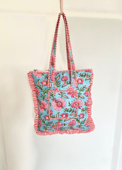 Gewatteerde laptoptas met volant blauw/roze