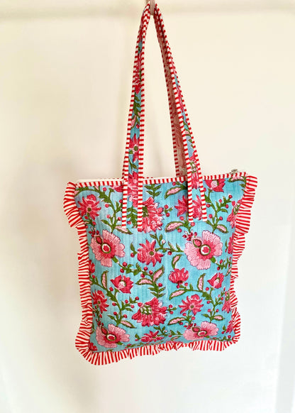 Gewatteerde laptoptas met volant blauw/roze