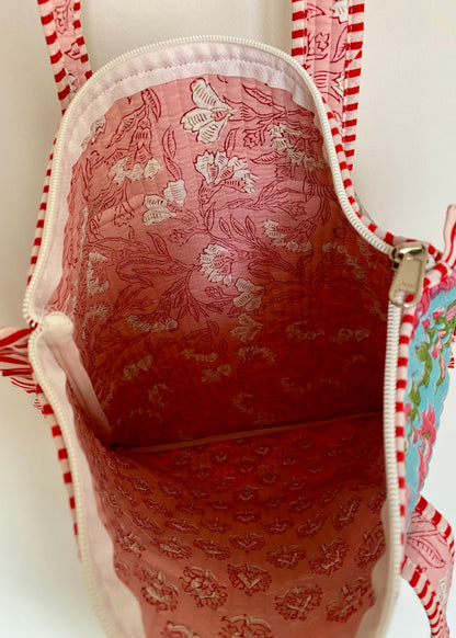 Gewatteerde laptoptas met volant blauw/roze